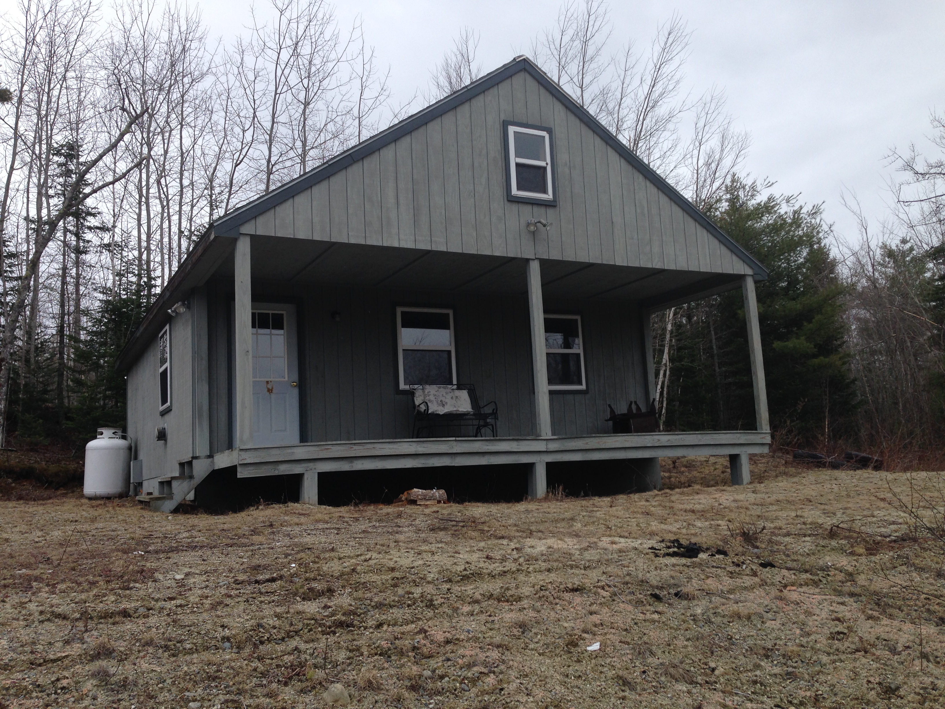 Rustic camp exterior in the Maine woods